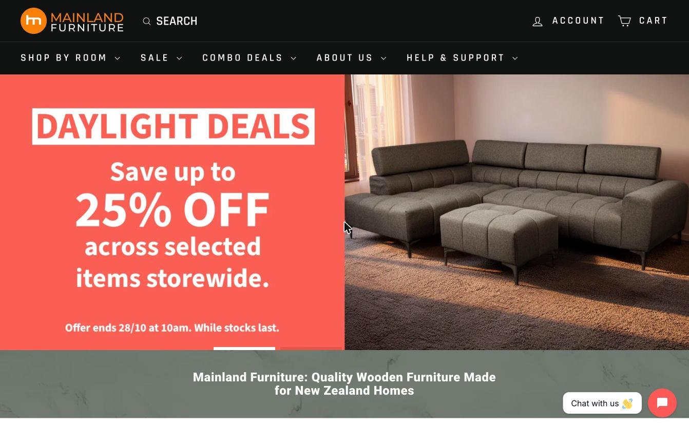 Mainland Furniture homepage in October 2026: a dark header with the circular logo, a sale banner and a photo of a grey sofa.